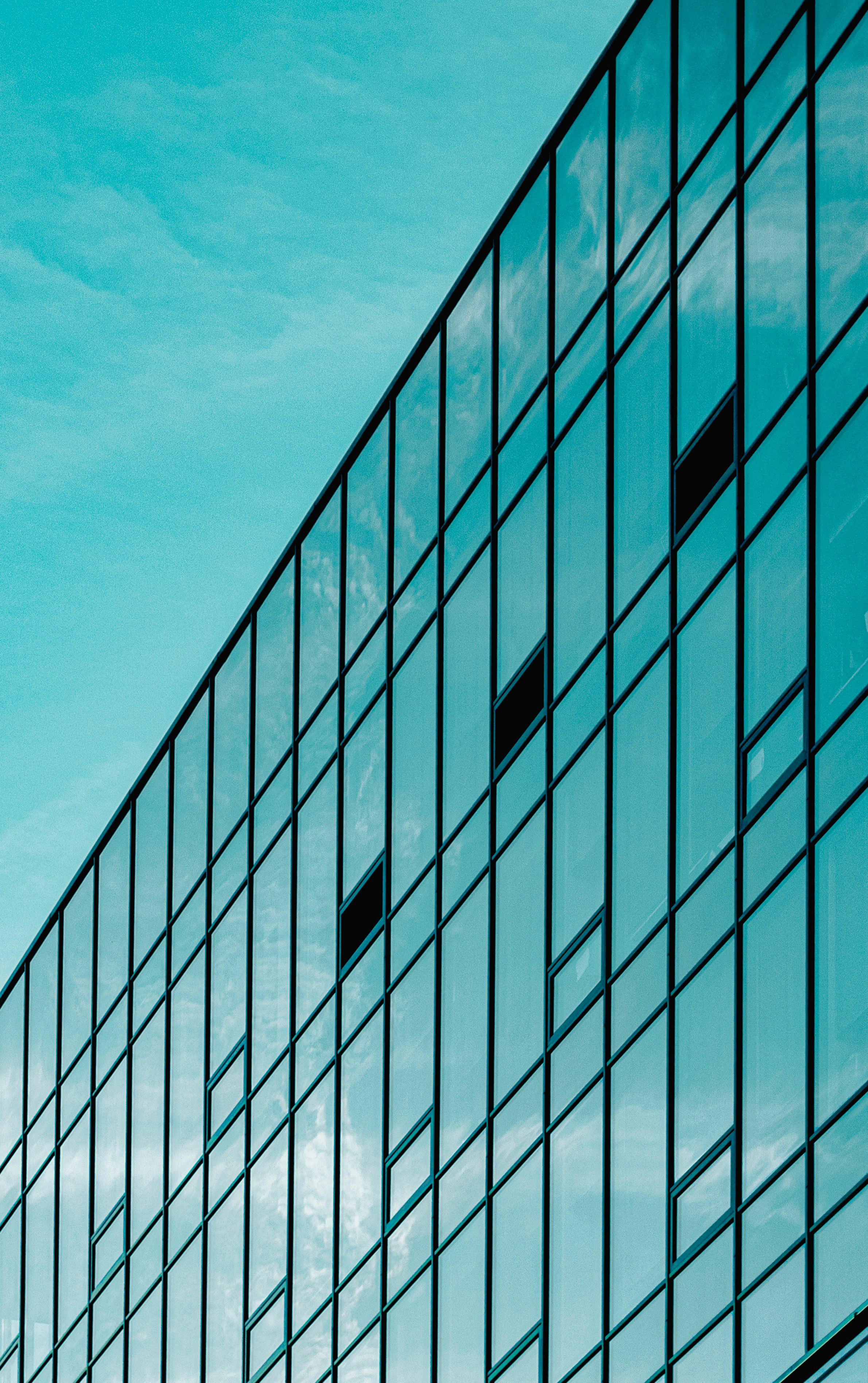 white and black concrete building under blue sky during daytime